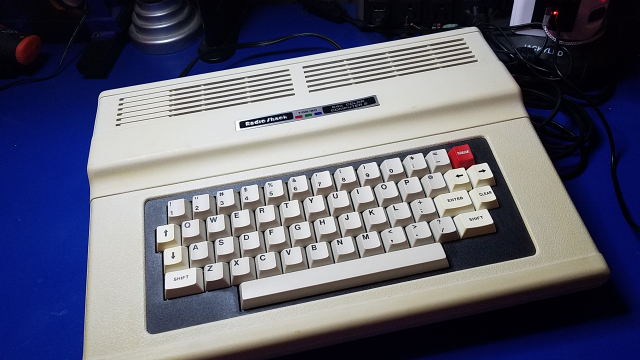 Vintage computer with a mechanical keyboard.