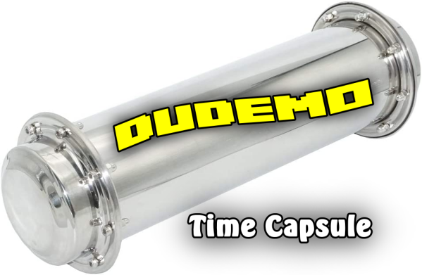 Metallic time capsule with "DudemO" label.